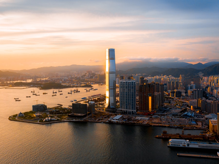 A stunning view of the Hong Kong skyline at sunset, with colorful buildings and skyscrapers reflecting the golden light.